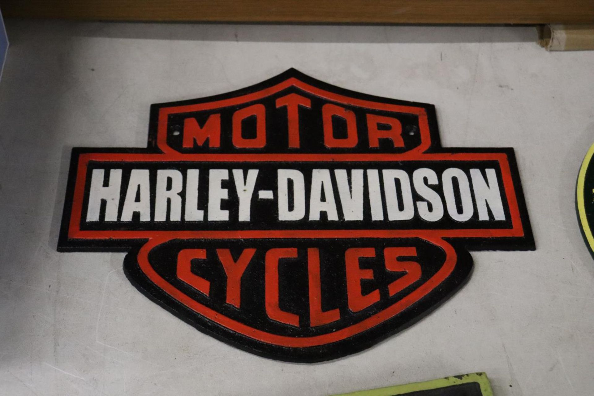 A CAST HARLEY DAVIDSON SIGN