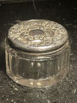 A HALLMARKED SILVER TOPPED GLASS POT