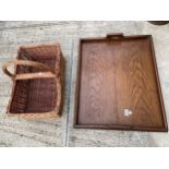 A LARGE OAK SERVING TRAY AND A WICKER BASKET