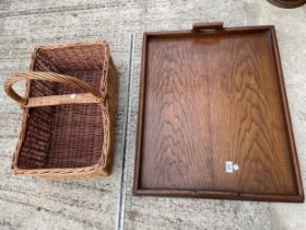 A LARGE OAK SERVING TRAY AND A WICKER BASKET