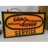 A DOUBLE SIDED LAND ROVER SERVICE BIRMINGHAM ENGLAND ILLUMINATED SIGN COMPLETE WITH HANGING BRACKET