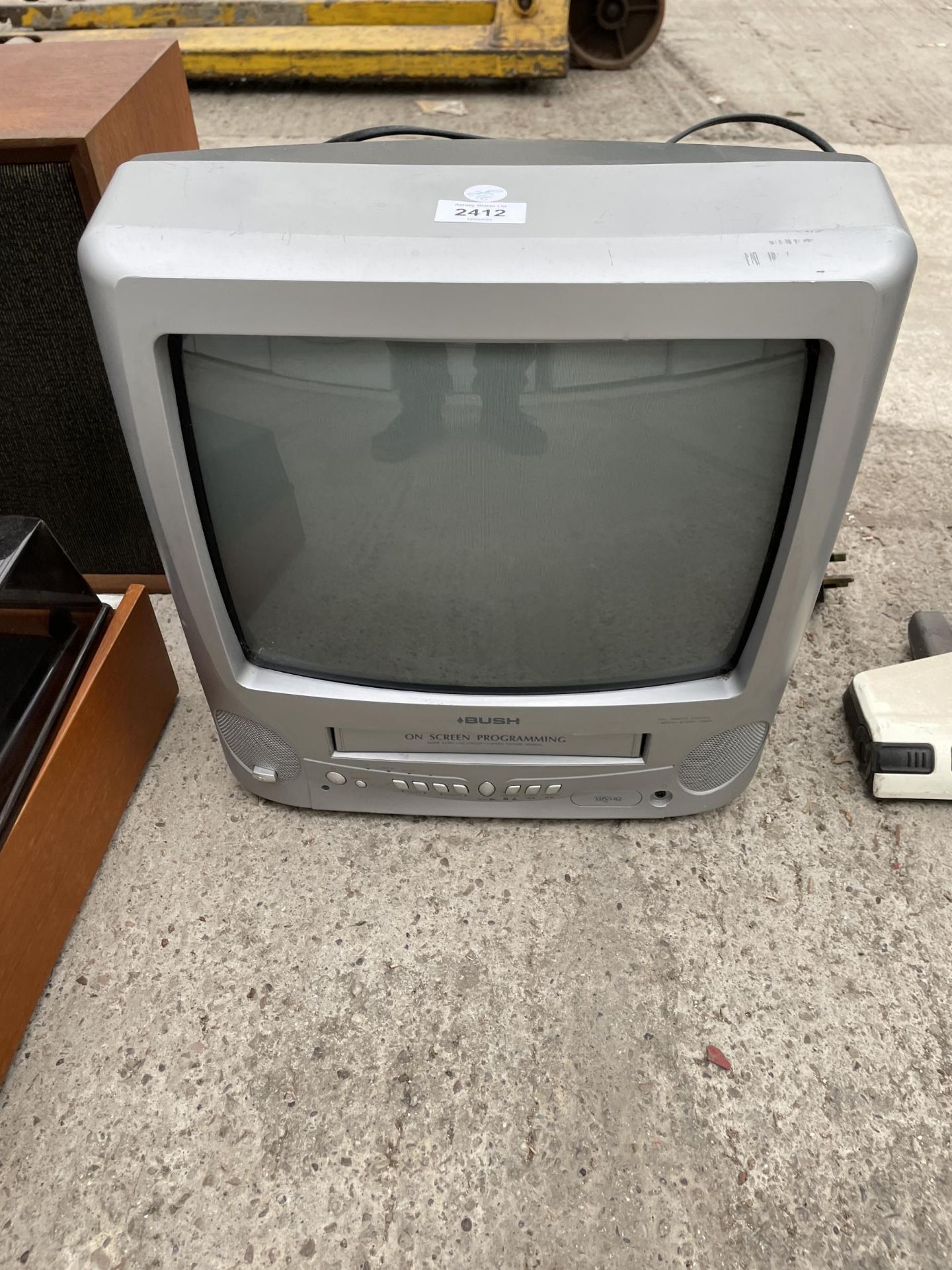 A BUSH PORTABLE TELEVISION WITH VHS PLAYER