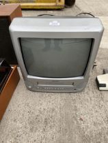 A BUSH PORTABLE TELEVISION WITH VHS PLAYER