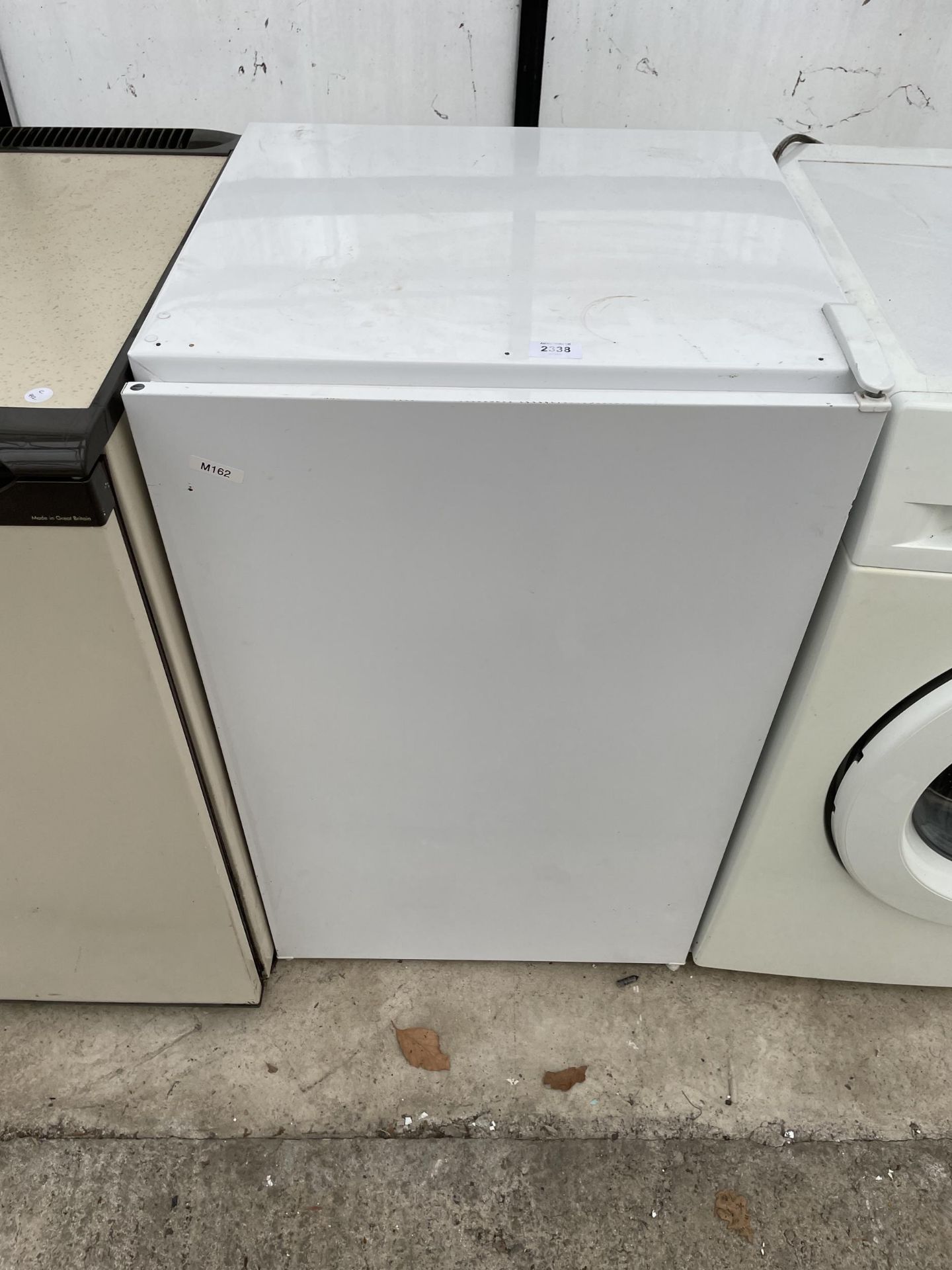 A WHITE UNDERCOUNTER FRIDGE