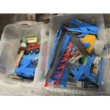 TWO BOXES OF TOMY RAIL TRACK WITH ACCESSORIES TO INCLUDE TURNTABLE, TRAINS, CARRIAGES, ETC.,