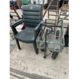 A METAL FOUR WHEELED MARKET GARDENERS TROLLEY AND TWO PLASTIC STACKING CHAIRS