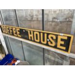 A WOODEN HAND PAINTED COFFEE SHOP SIGN