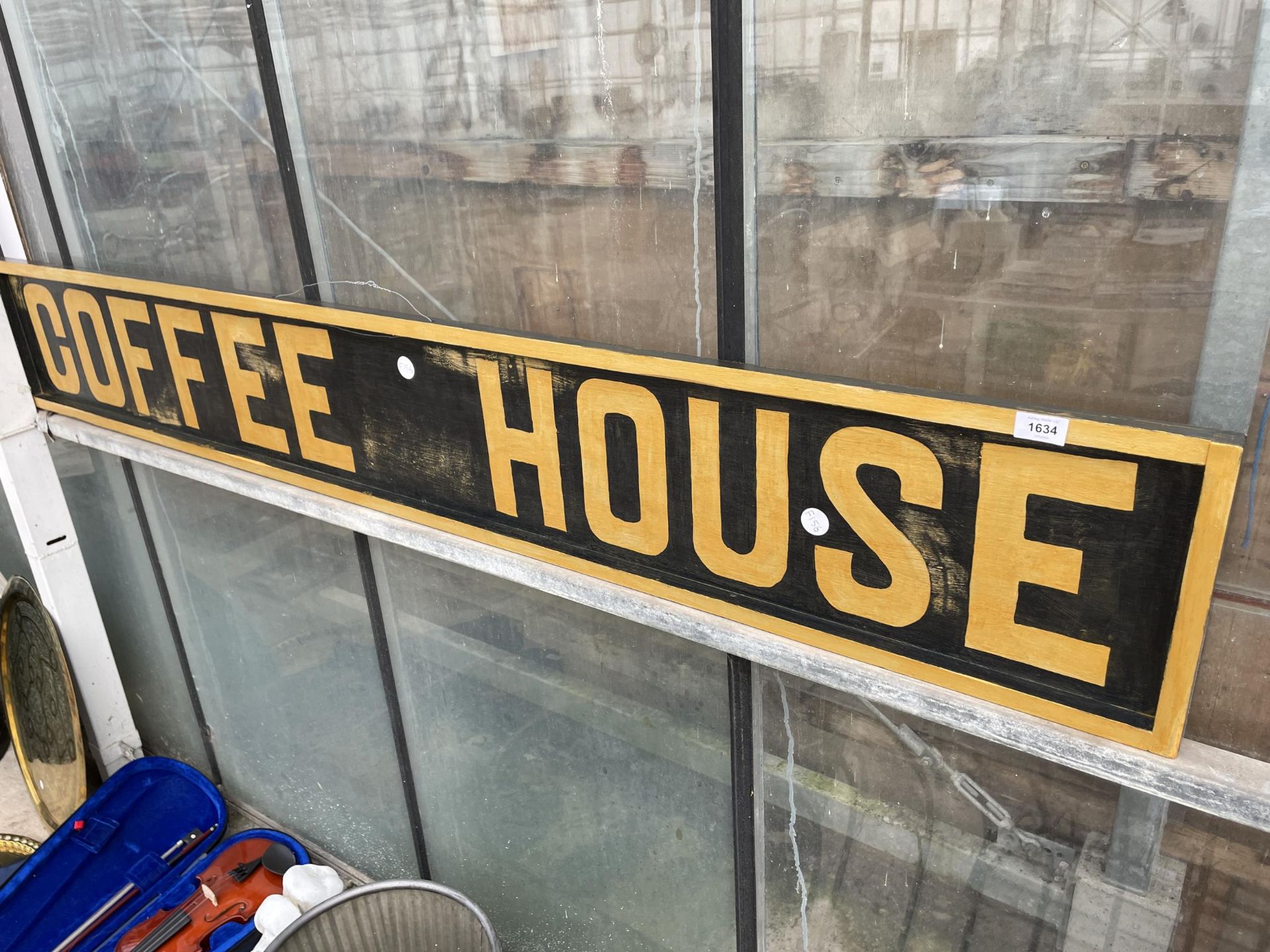 A WOODEN HAND PAINTED COFFEE SHOP SIGN