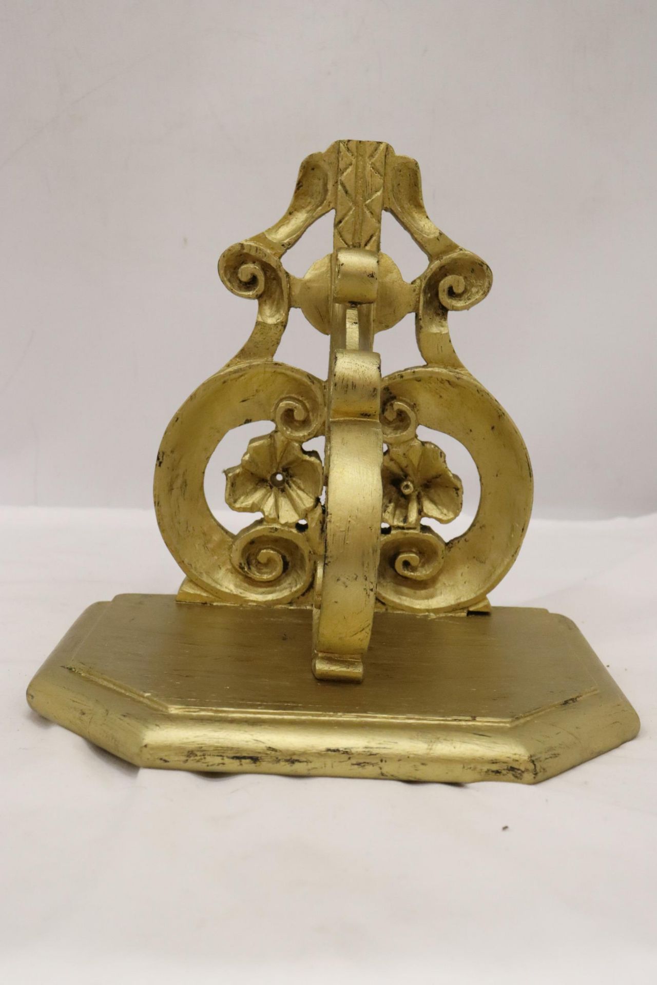 A GILDED OAK WALL BRACKET