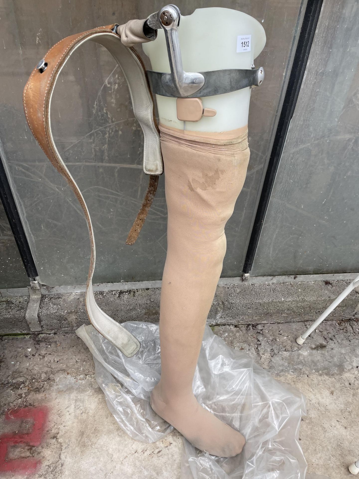 A PROSTHETIC LEG WITH STRAP AND BRACKET (L:93CM)