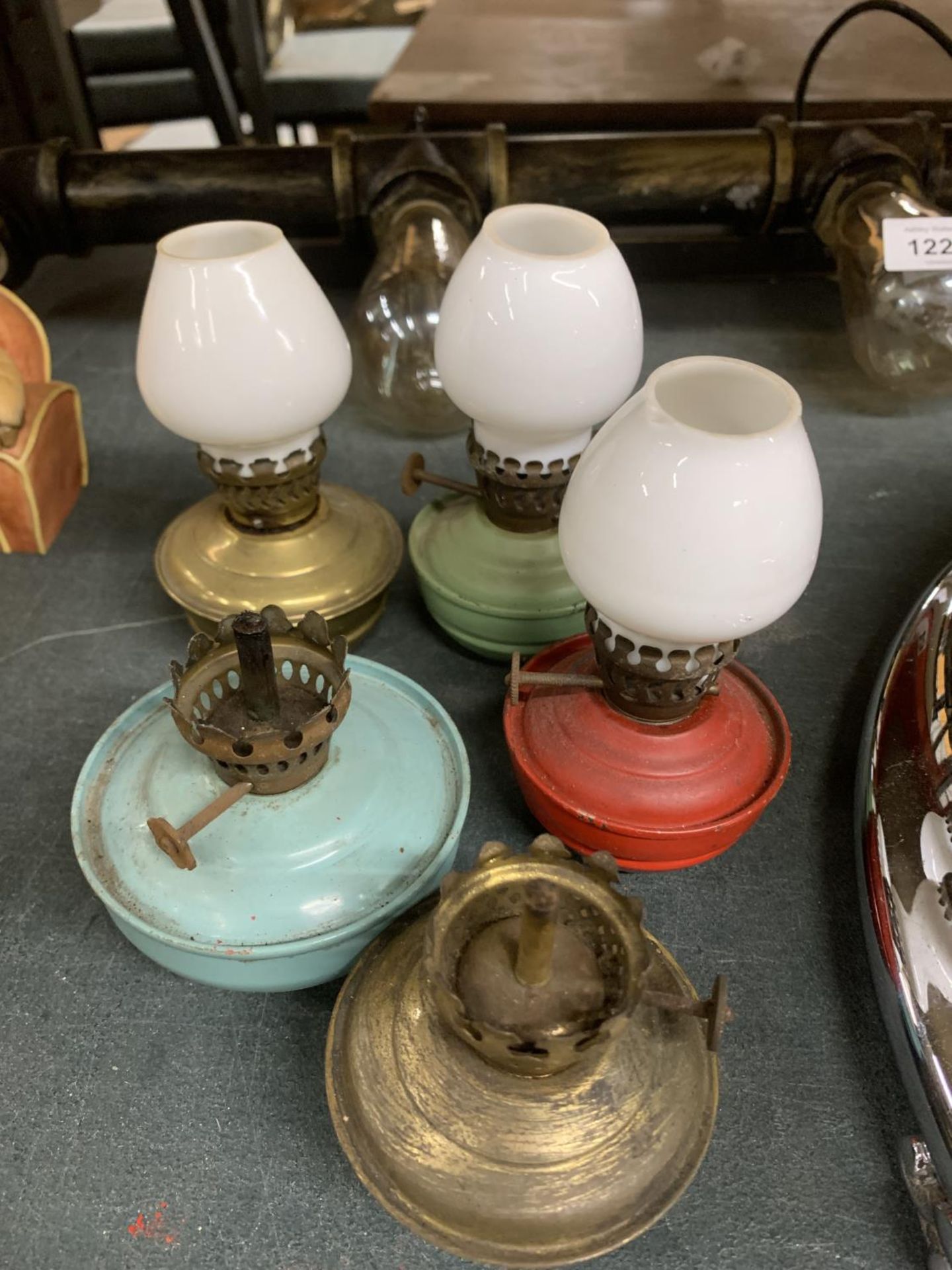 FIVE VINTAGE MINI PARAFFIN LAMPS, THREE WITH SHADES