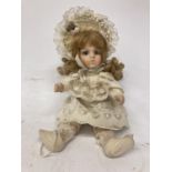 A VINTAGE SHOW STOPPER PORCELAIN DOLL WITH A LACE DRESS AND PAINTED BOOTS