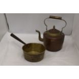 A HEAVY BRASS SAUCEPAN AND A COPPER AND BRASS KETTLE