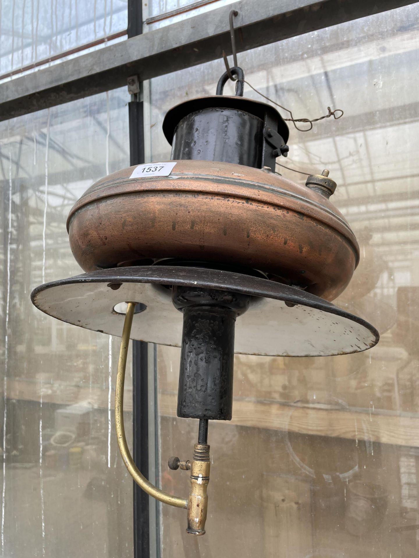 A VINTAGE COPPER AND STEEL HANGING PARAFIN LIGHT