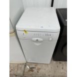 A WHITE INDESIT SLIMLINE DISH WASHER