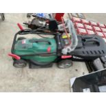 AN ELECTRIC QUALCAST LAWN MOWER WITH GRASS BOX