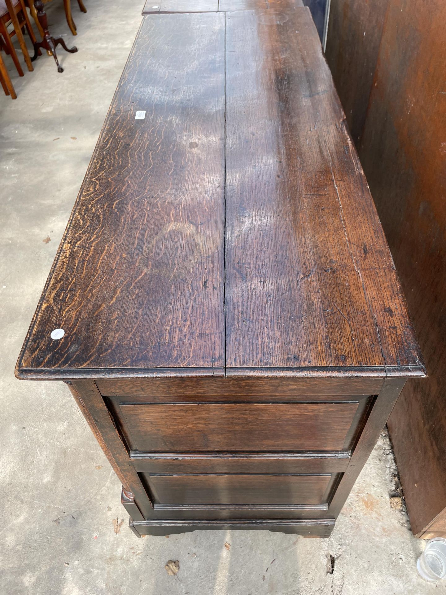 A GEORGE III OAK LANCASHIRE CHEST WITH A THREE PANEL FRONT AND TWO DRAWERS TO BASE ON BRACKET FEET - Image 3 of 6