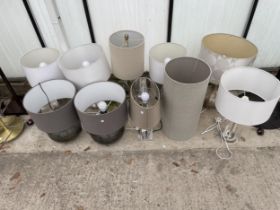 A LARGE ASSORTMENT OF TABLE LAMPS WITH SHADES