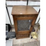 AN OAK RECORD CABINET CONTAINING A SONY COMPACT HI-FI STEREO SYSTEM