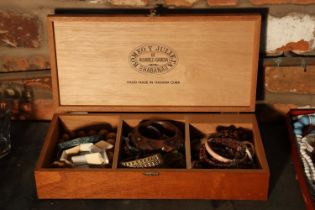 A BOX CONTAINING COSTUME JEWELLERY MAINLY BANGLES AND NECKLACES