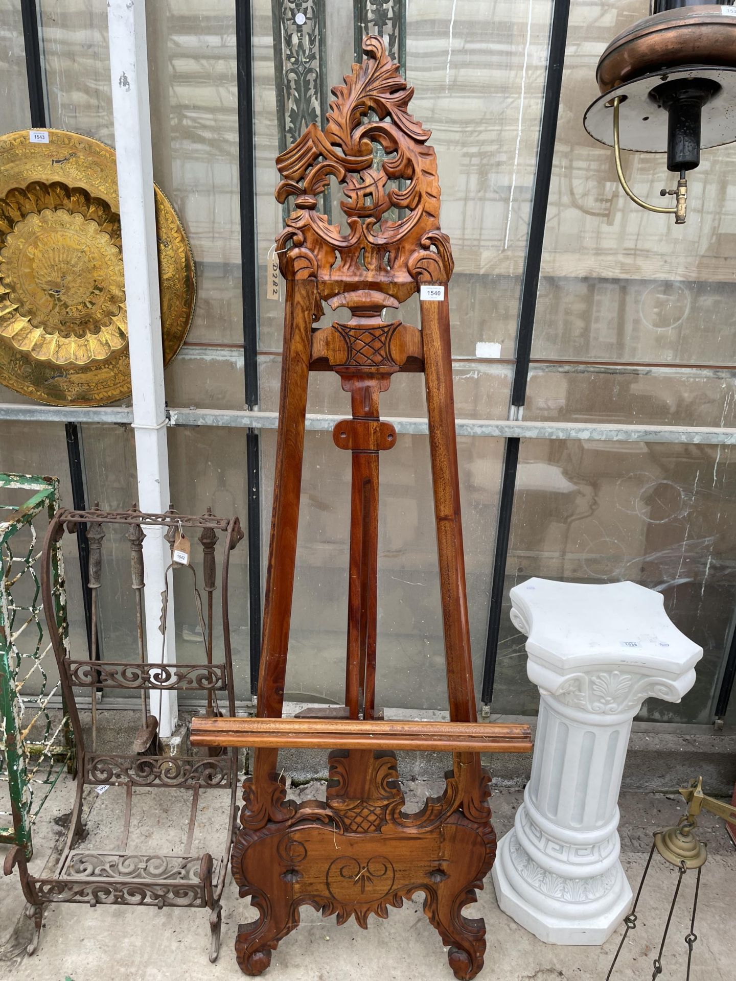 A LARGE DECORATIVE CARVED HARD WOOD EASEL