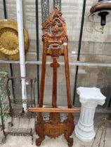 A LARGE DECORATIVE CARVED HARD WOOD EASEL