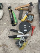 A COLLECTION OF HAND TOOLS TO INCLUDE PRUNERS, AN AXE AND A TAPE MEASURE ETC