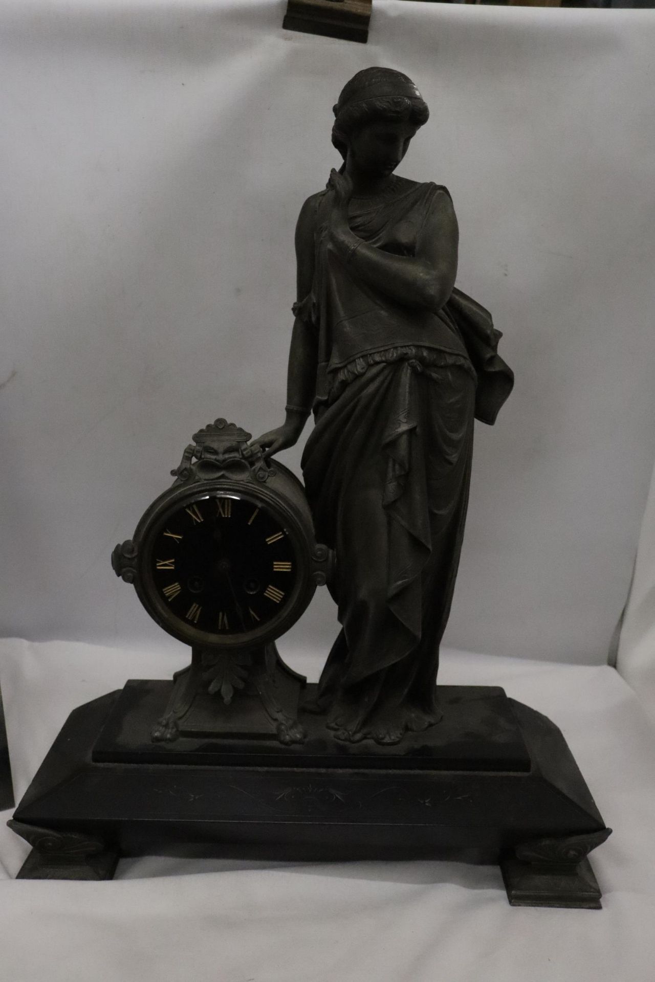 A PENDULUM MANTLE CLOCK IN NAPOLEON III STYLE REPRESENTING A WOMAN HEIGHT 54CM