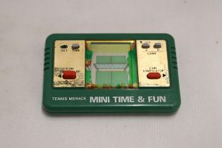 A VINTAGE HAND HELD 1980'S, TENNIS MENACE MINI TIME AND FUN, WORKING AT TIME OF CATALOGUING, NO