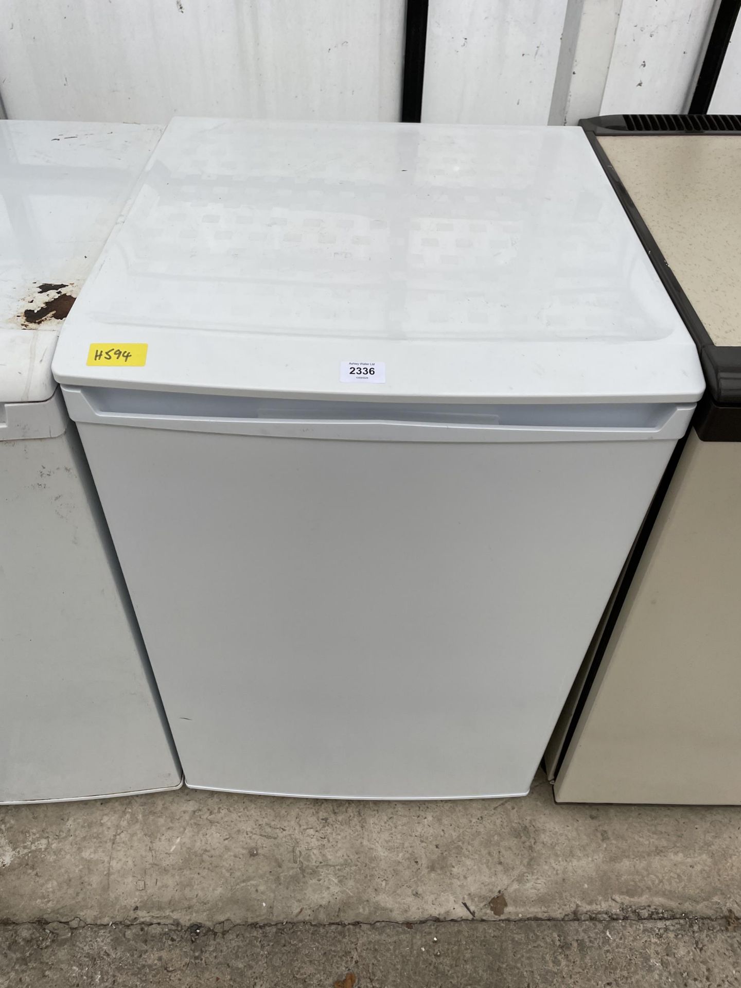 A WHITE UNDERCOUNTER FRIDGE