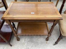 A MID 20TH CENTURY OAK TWO TIER TROLLEY ( LACKING CASTERS)