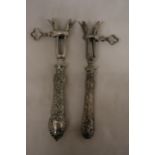 TWO VINTAGE CONTINENTAL, POSSIBLY SILVER, HANDLED GIGOT LAMB SHANK/HAM BONE HOLDERS