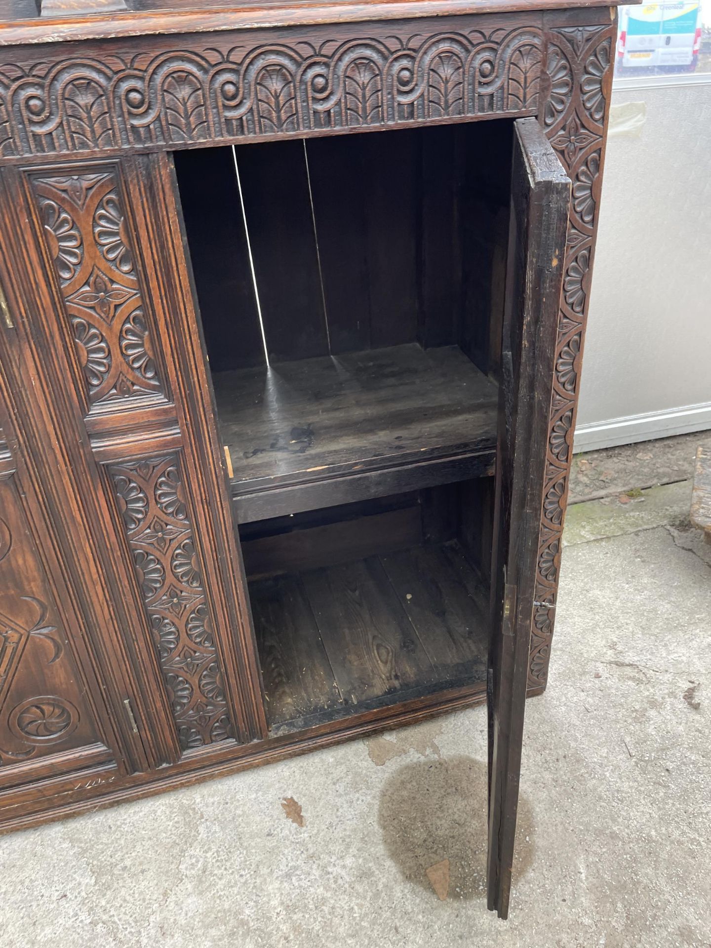 AN OAK GEORGE III STYLE COURT CUPBOARD WITH CARVED PANELS, THREE DEPICTING THE BIRTH AND CRUCIFIXION - Image 11 of 12