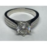 A MARKED 9K RING SET WITH A 1 CARAT OF MOISSANITE AS A SOLITAIRE AND CHIPS TO SHOULDERS SIZE I