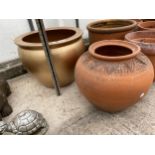 A TERRACOTTA PLANTER AND A FURTHER GILT TERRACOTTA PLANTER