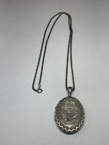 A WWI SILVER LOCKET AND CHAIN