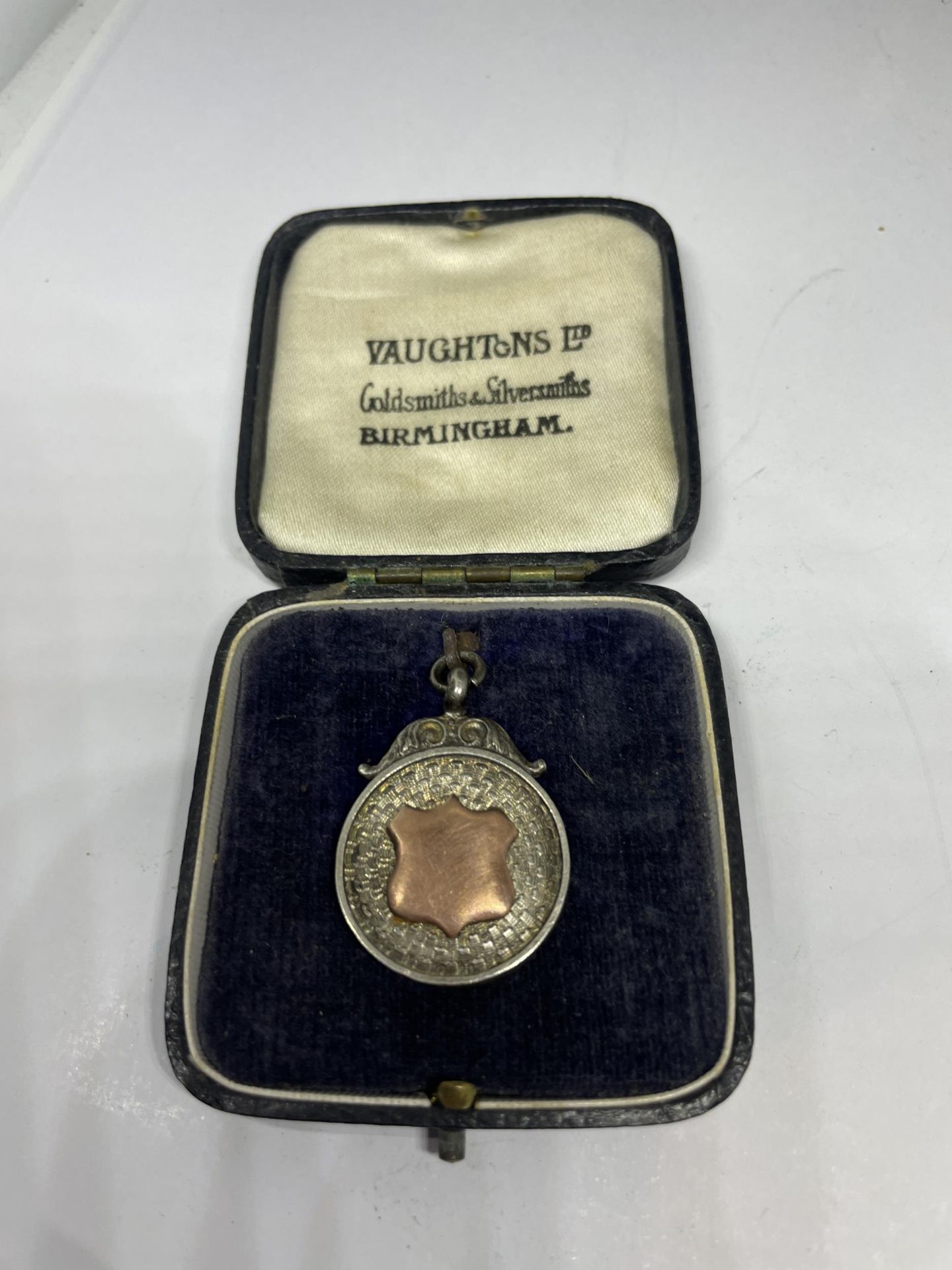 A BIRMINGHAM HALLMARKED SILVER FOOTBALL MEDAL IN ITS ORIGINAL DERBYSHIRE FOOTBALL ASSOCIATION