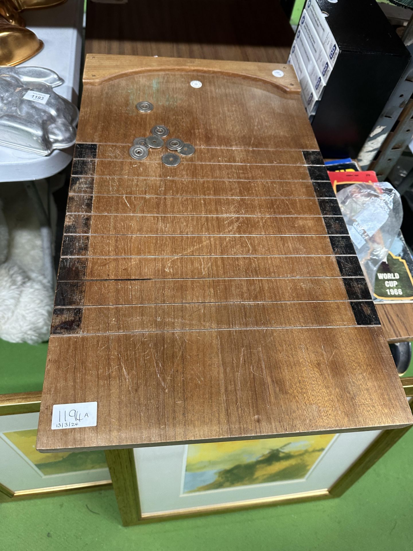 A VINTAGE WOODEN SHOVE HA'PENNY BOARD WITH TOKENS, WITH THE MAKERS NAME W WISDEN AND SONS, DUKE