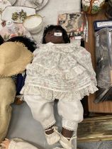 A GOTZ CARLOS 90/133 LARENE DRIBBLE BABY DOLL BY CARIN LOSSNITIZER MADE OF VINYL AND CLOTH