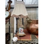 A DECORATIVE BRASS TABLE LAMP WITH CERAMIC FEMALE FIGURE