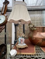 A DECORATIVE BRASS TABLE LAMP WITH CERAMIC FEMALE FIGURE