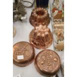 FOUR COPPER JELLY MOULDS