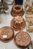FOUR COPPER JELLY MOULDS