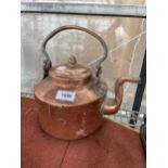 A VINTAGE COPPER KETTLE