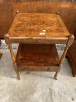 A YEW WOOD AND CROSS BANDED TWO TIER LAMP TABLE WITH SINGLE DRAWER AND SLIDE