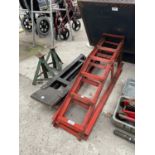A PAIR OF METAL CAR RAMPS AND TWO AXEL STANDS