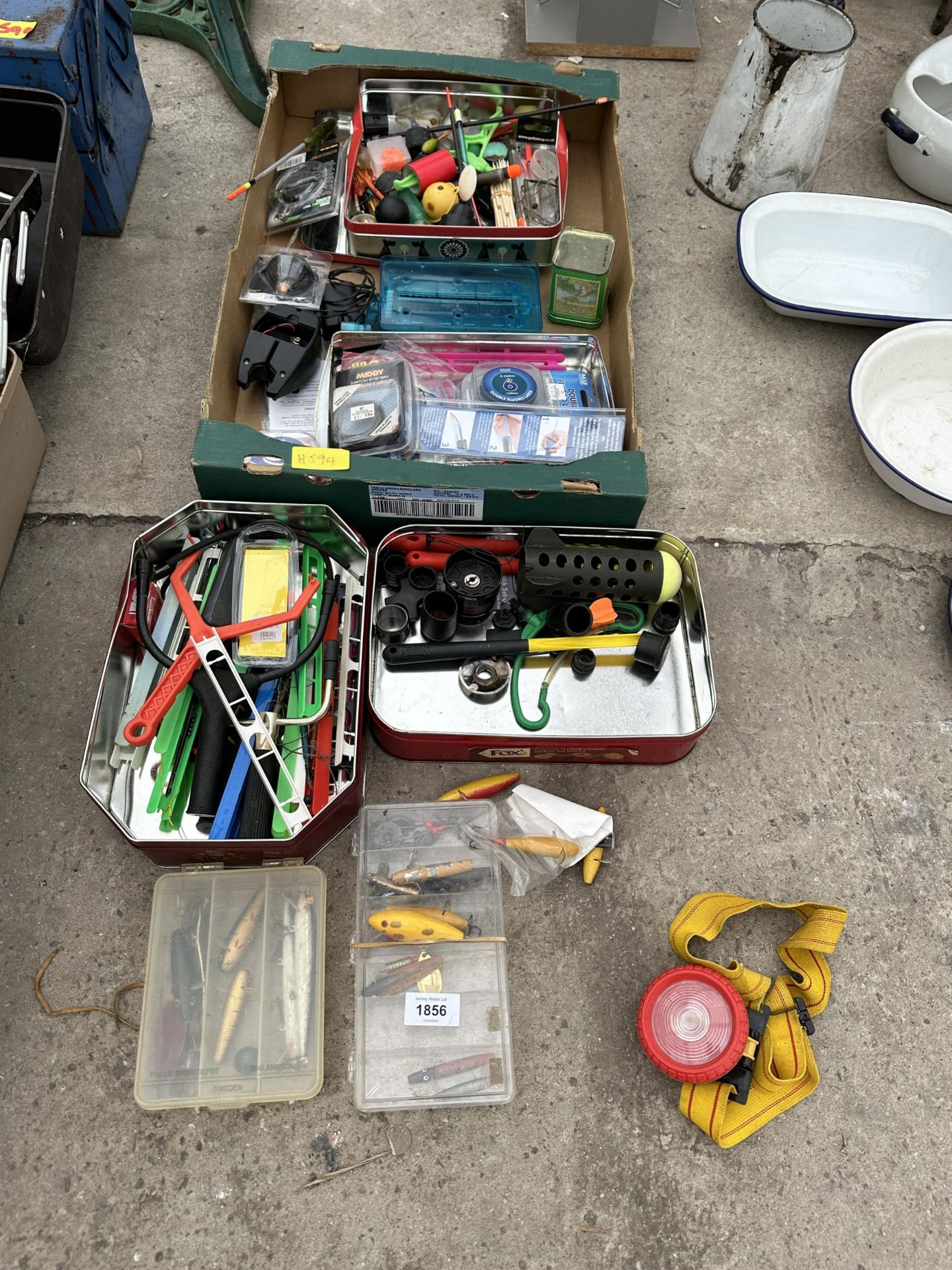 AN ASSORTMENT OF FISHING TACKLE TO INCLUDE LURES, FLOATS AND FEEDERS ETC