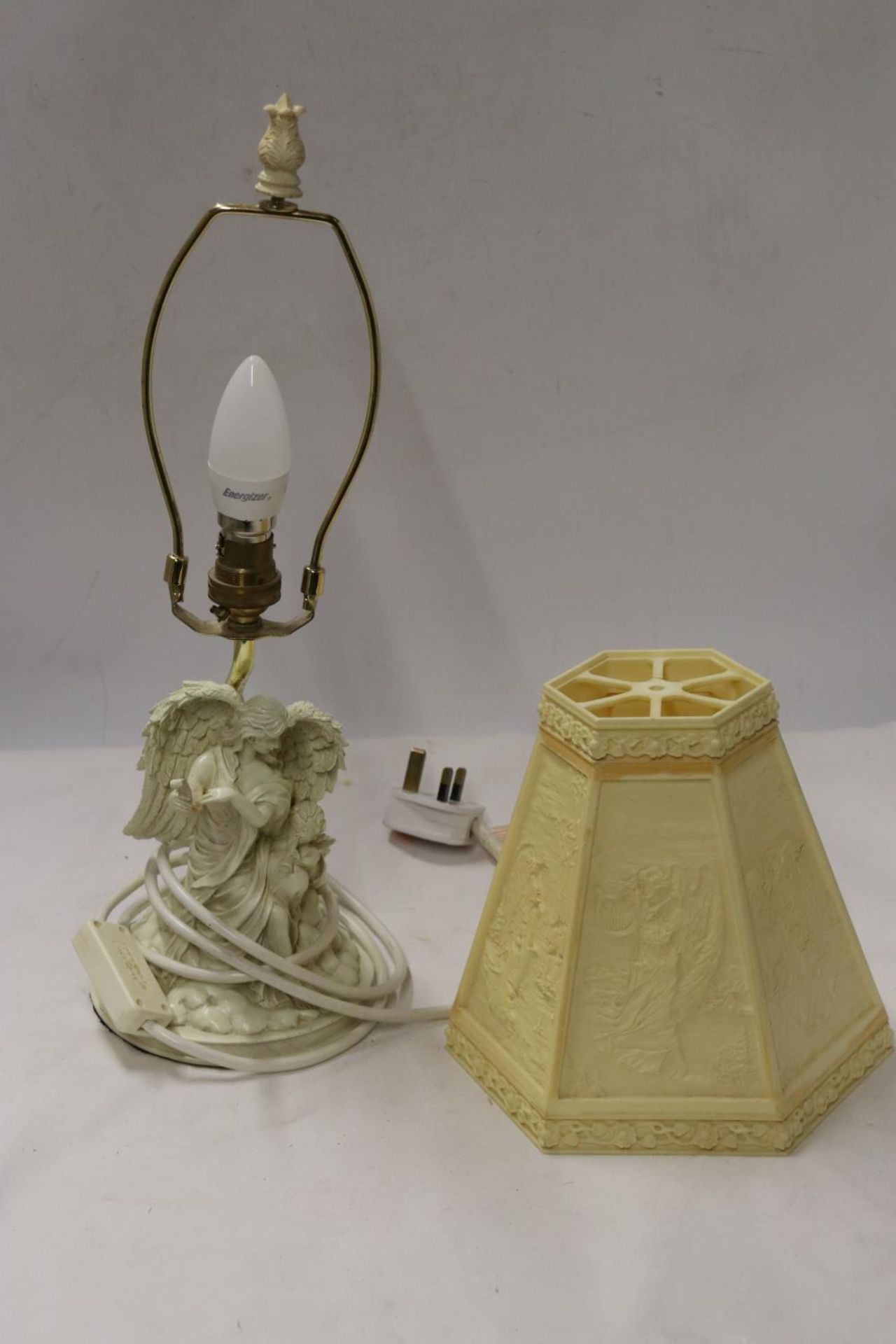 A TABLE LAMP WITH A CLASSICAL FIGURE TO THE BASE AND LAMP SHADE