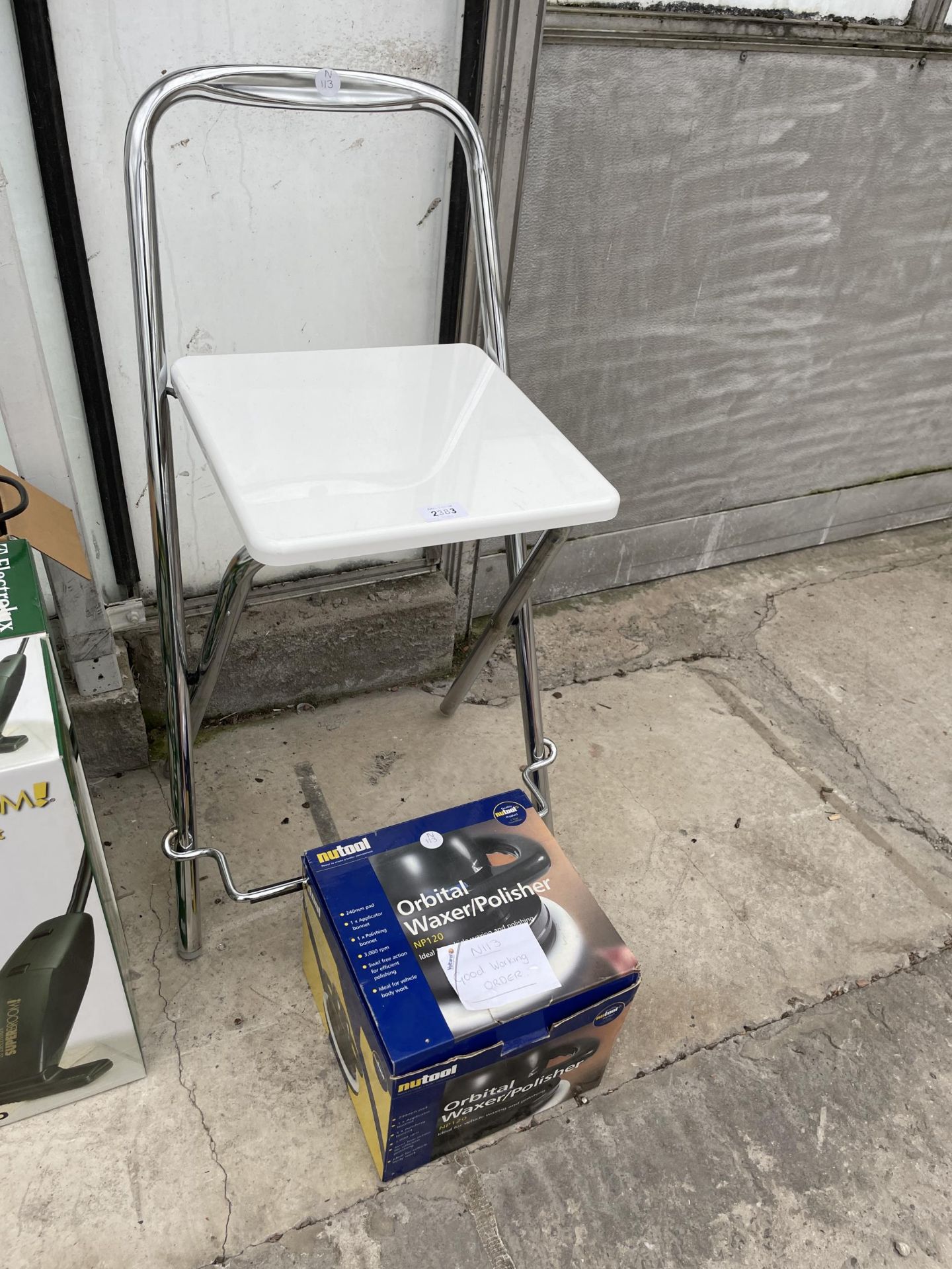 A STOOL AND A CAR POLISHER