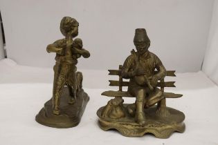 A BRASS FIGURE OF A BOY WITH PUPPY DOGS, HEIGHT 20CM, WIDTH 20CM TOGETHER WITH A BRASS LADEL AND A
